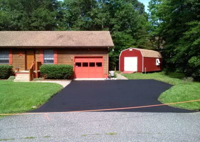Newly paved asphalt road in a neighborhood - Five Star Asphalt | PA